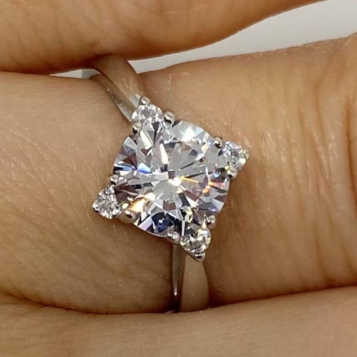 2 carat kite shaped cz engagement ring on ladies finger