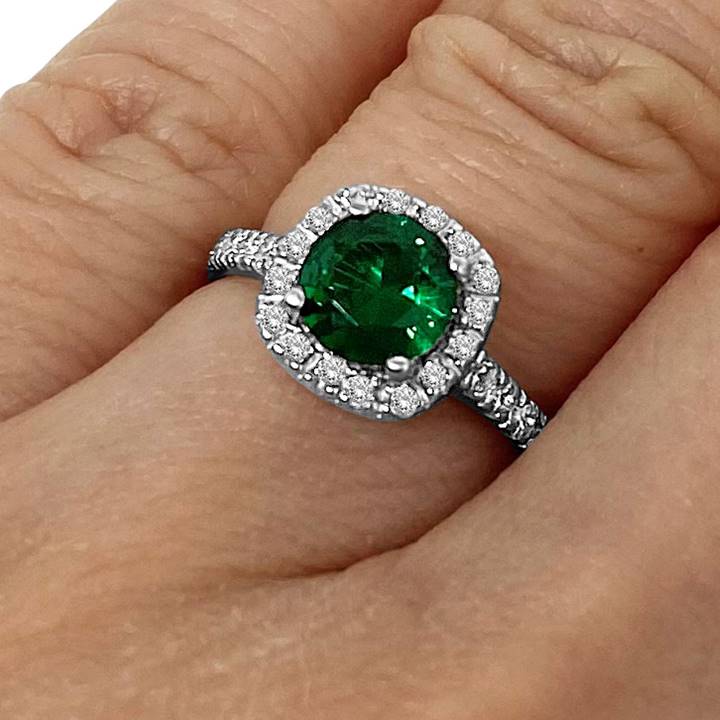 Silver emerald ring on small hand