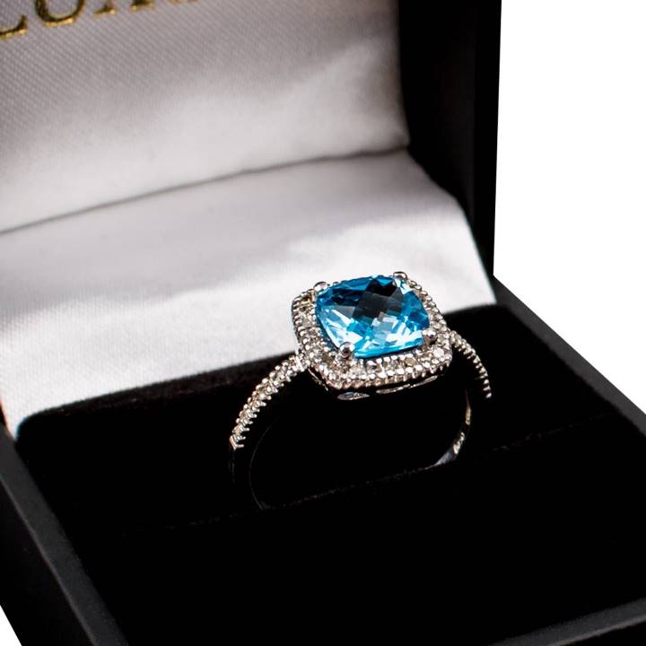 10k cushion cut blue topaz gemstone and diamond halo ring